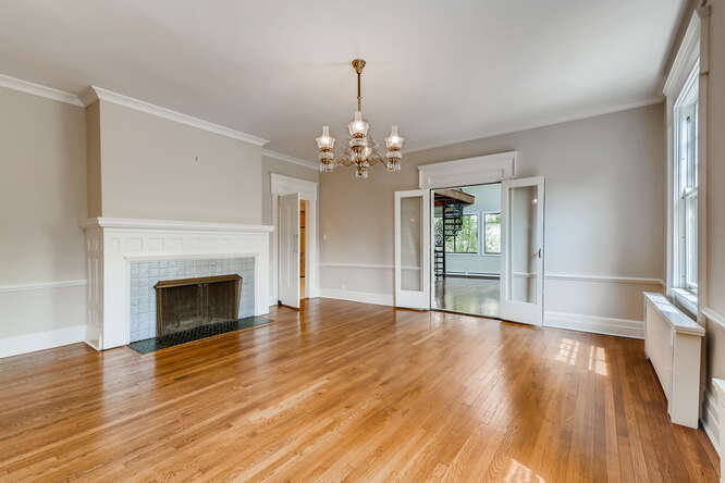 321 North Delaplaine Road Riverside, IL 60546 - Photo 16 of 52 a view of a livingroom with wooden floor a fireplace and window