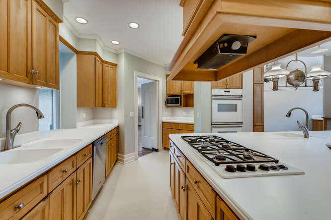 321 North Delaplaine Road Riverside, IL 60546 - Photo 22 of 52 a kitchen with stainless steel appliances granite countertop a sink a stove and a refrigerator