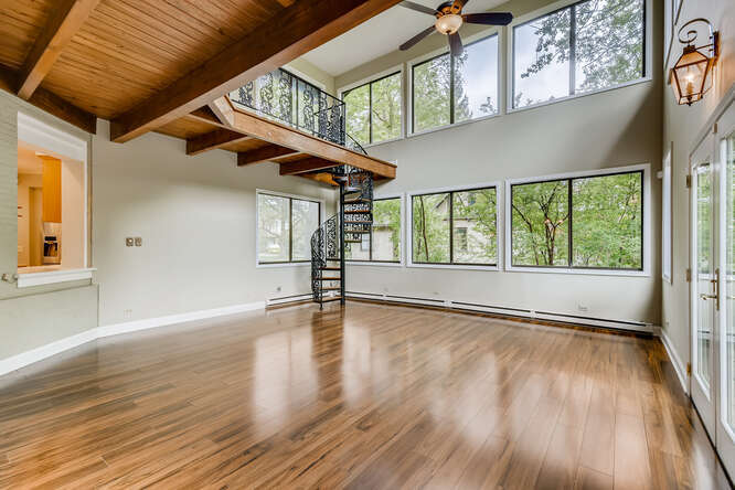 321 North Delaplaine Road Riverside, IL 60546 - Photo 26 of 52 a view of an empty room with wooden floor and a window
