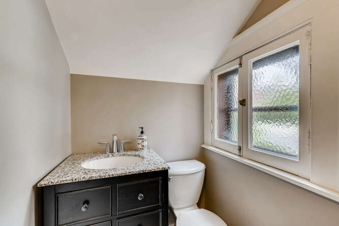 321 North Delaplaine Road Riverside, IL 60546 - Photo 30 of 52 a bathroom with a granite countertop sink toilet and large mirror