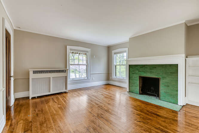 321 North Delaplaine Road Riverside, IL 60546 - Photo 35 of 52 a view of empty room with wooden floor and fireplace
