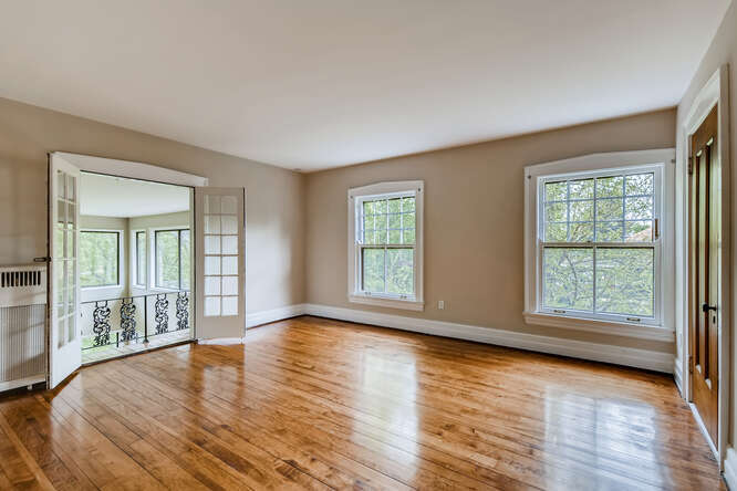 321 North Delaplaine Road Riverside, IL 60546 - Photo 40 of 52 an empty room with wooden floor and windows