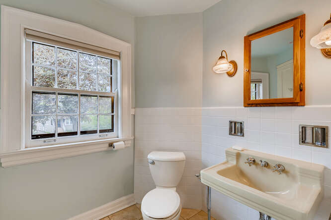 321 North Delaplaine Road Riverside, IL 60546 - Photo 43 of 52 a bathroom with a toilet sink and mirror