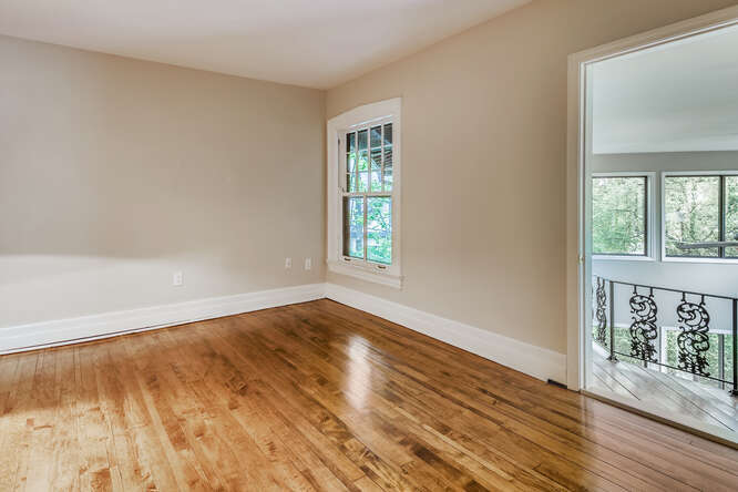 321 North Delaplaine Road Riverside, IL 60546 - Photo 44 of 52 a view of an empty room with wooden floor and a window