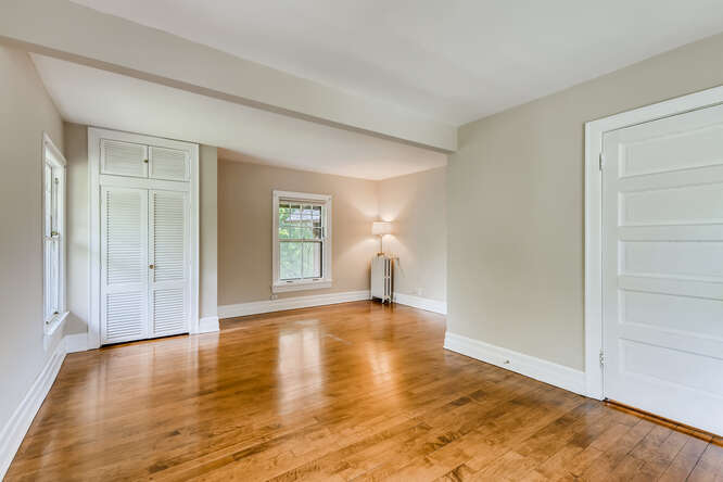 321 North Delaplaine Road Riverside, IL 60546 - Photo 45 of 52 a view of empty room with wooden floor and fan