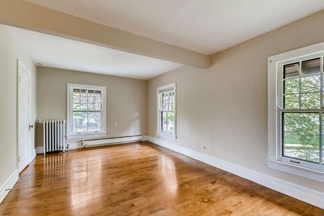321 North Delaplaine Road Riverside, IL 60546 - Photo 46 of 52 a view of an empty room with wooden floor and a window