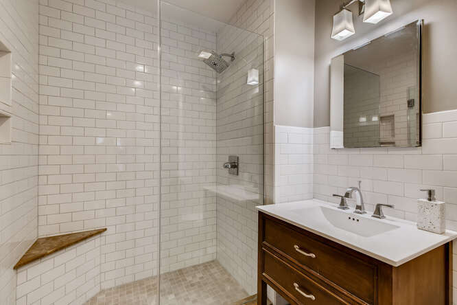 321 North Delaplaine Road Riverside, IL 60546 - Photo 47 of 52 a bathroom with a sink mirror and a shower