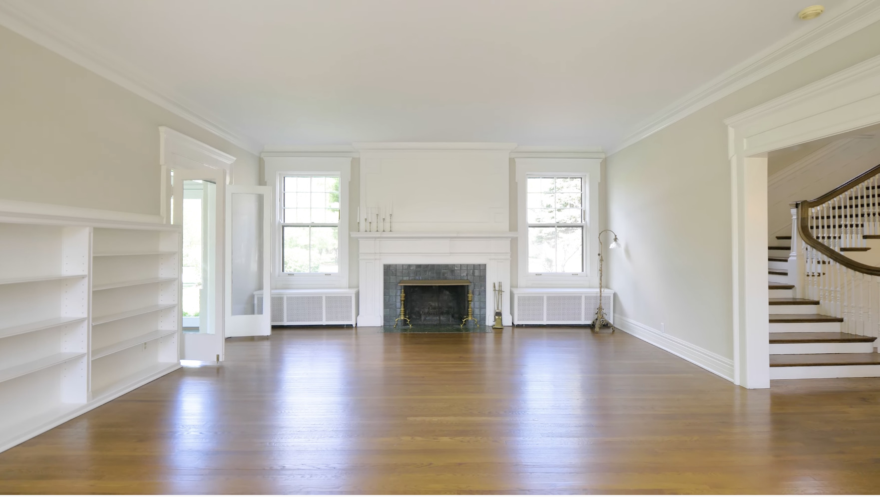 321 North Delaplaine Road Riverside, IL 60546 - Photo 8 of 52 an empty room with wooden floor fireplace and windows