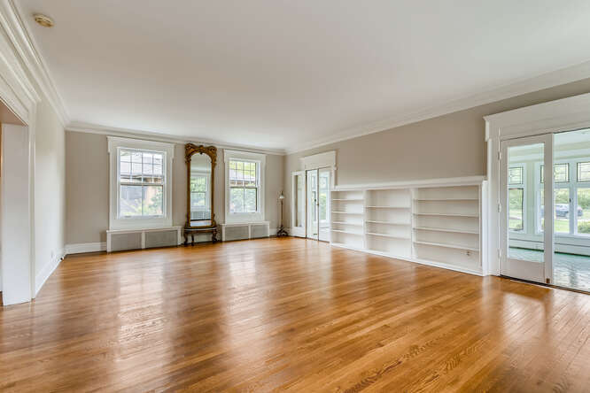 321 North Delaplaine Road Riverside, IL 60546 - Photo 10 of 52 an empty room with wooden floor and windows