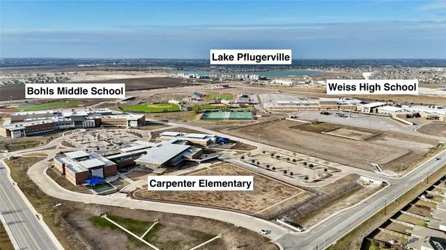 a front view of a building with sitting area