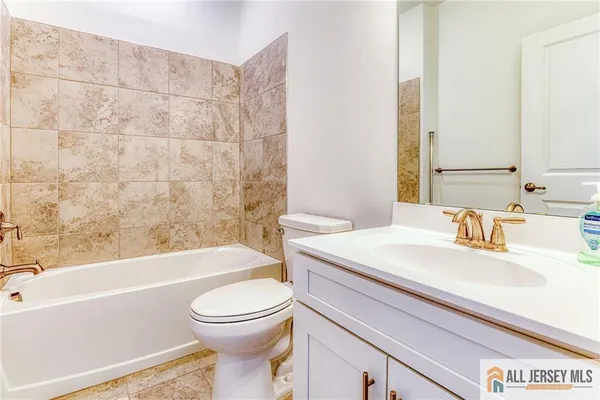 a bathroom with a sink a toilet and a bathtub