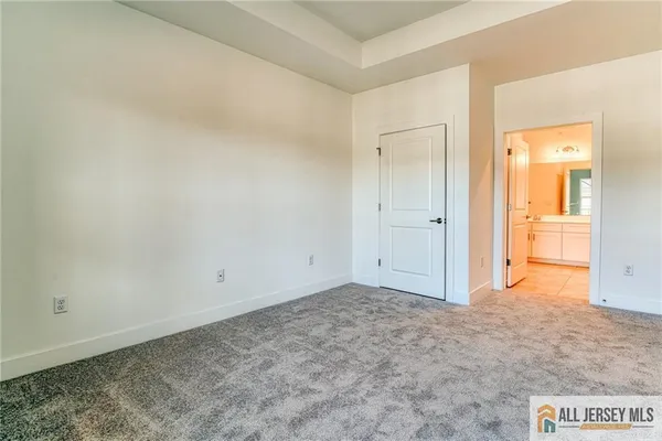 an empty room with closet area