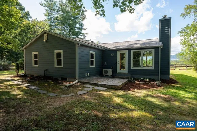 a view of house with yard