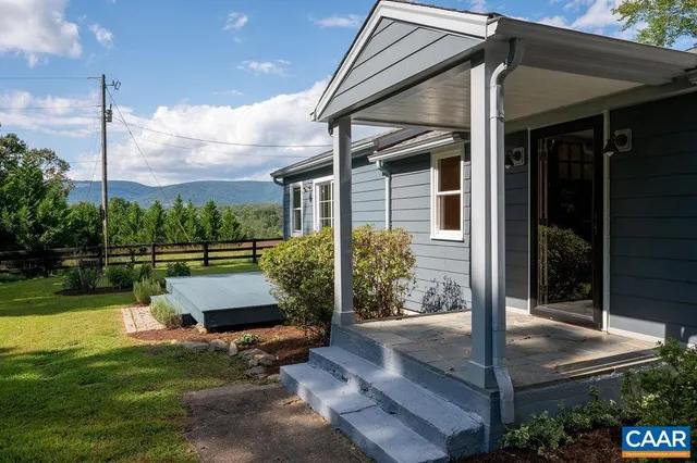 a view of a back yard of the house and a garden