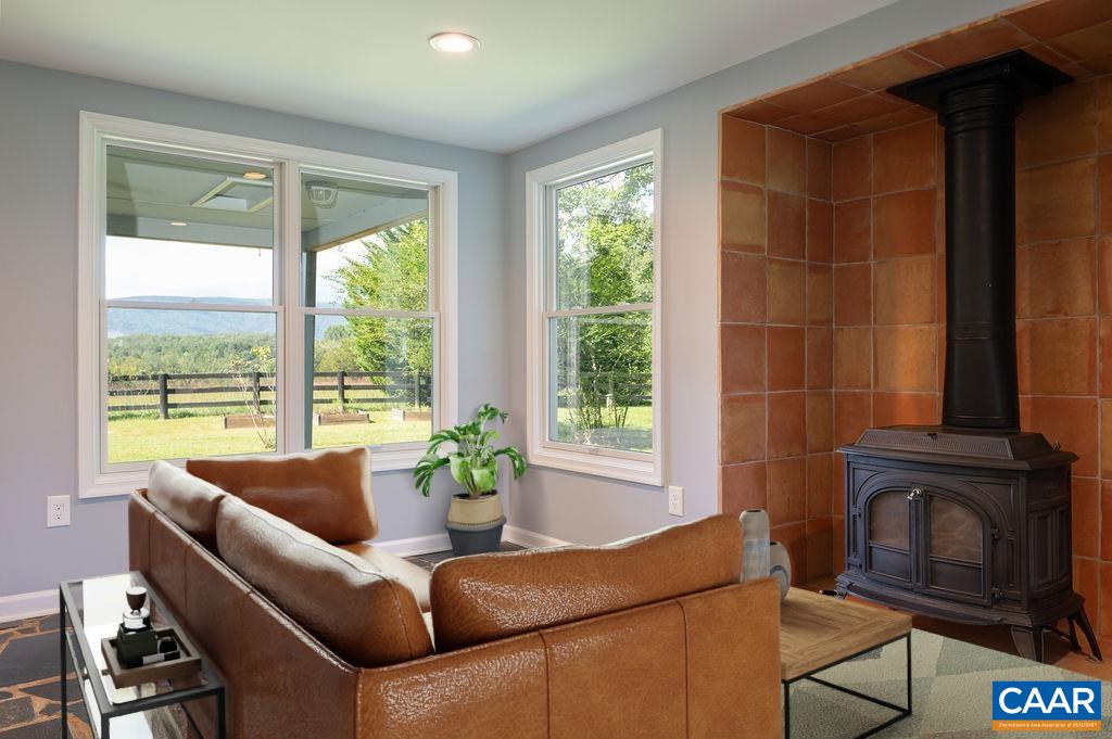 8165 Open Gate Lane Afton, VA 22920 - Photo 8 of 39 a living room with furniture and a fireplace