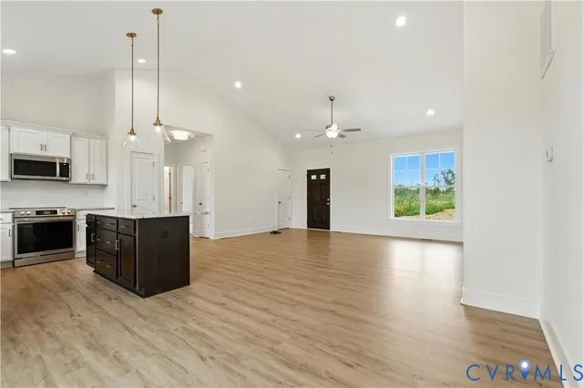 a view of kitchen with sink microwave and stove