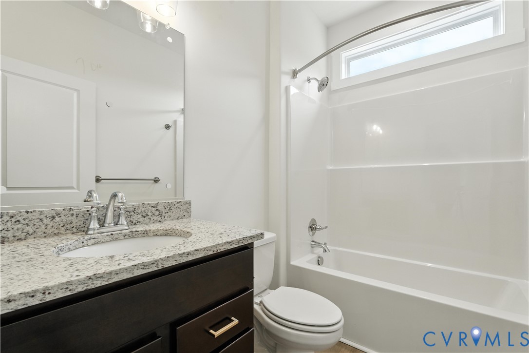 5782 Darlington Heights Road Cullen, VA 23934 - Photo 19 of 21 a bathroom with a granite countertop sink toilet and shower