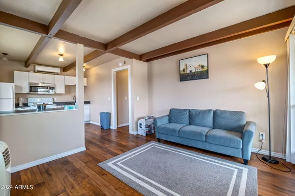 a bedroom with furniture and a window