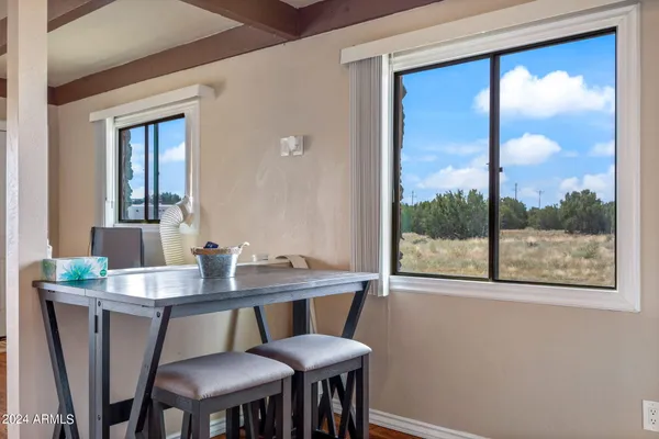 a bedroom with a bed and a lamp