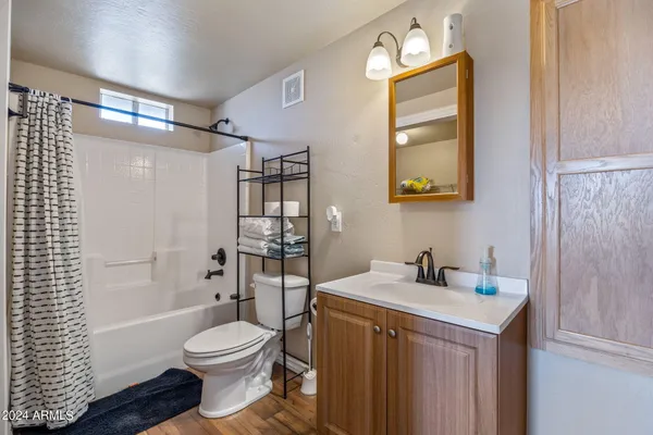 a view of storage and utility room with a fan