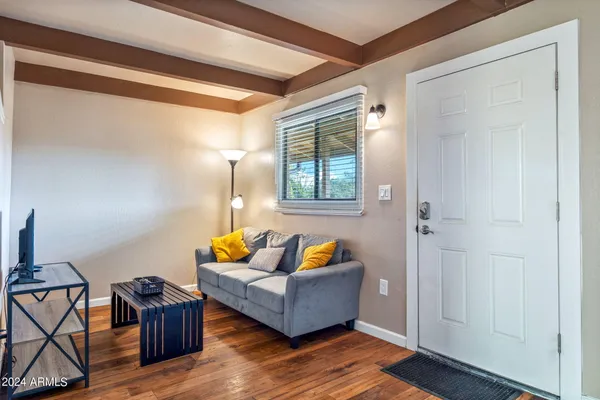 a living room with furniture and a flat screen tv