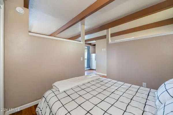a bathroom with a toilet sink vanity and shower