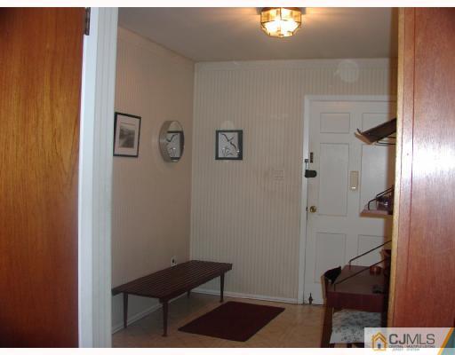 4 Newkirk Road Somerset, NJ 08873 - Photo 3 of 10 a view of hallway with furniture and wooden floor