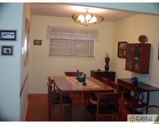 4 Newkirk Road Somerset, NJ 08873 - Photo 5 of 10 a view of a dining room with furniture and wooden floor