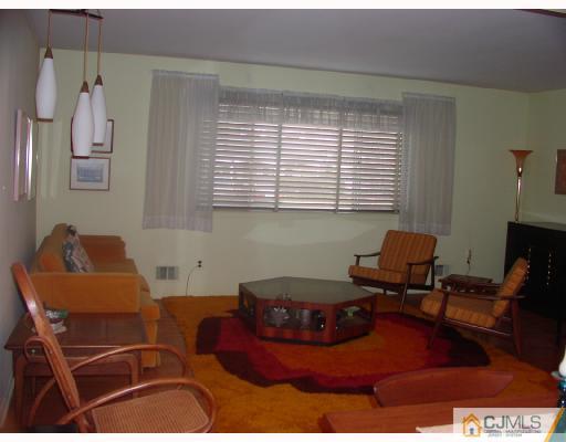 4 Newkirk Road Somerset, NJ 08873 - Photo 6 of 10 a room with furniture and a window