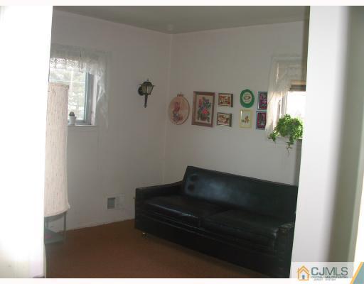 4 Newkirk Road Somerset, NJ 08873 - Photo 9 of 10 a living room with a couch