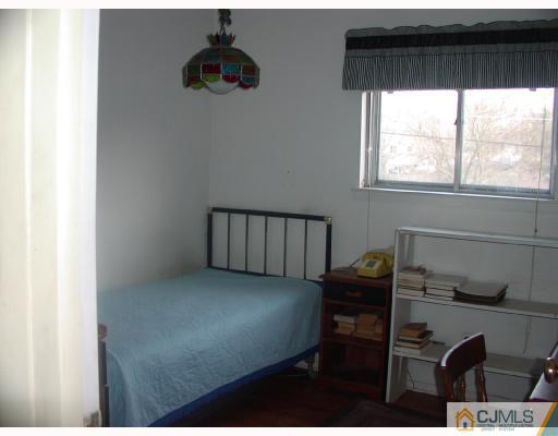 4 Newkirk Road Somerset, NJ 08873 - Photo 10 of 10 a bedroom with a bed and a window