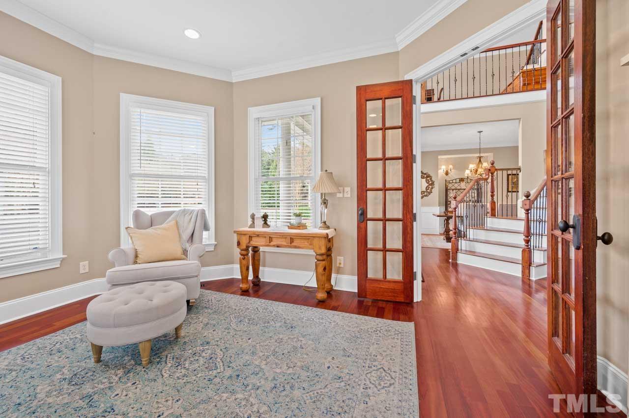 1605 Sharnbrook Court Raleigh, NC 27614 - Photo 16 of 63 a living room with furniture and a wooden floor