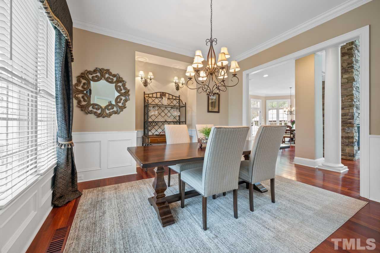 1605 Sharnbrook Court Raleigh, NC 27614 - Photo 19 of 63 a view of a dining room with furniture window and wooden floor