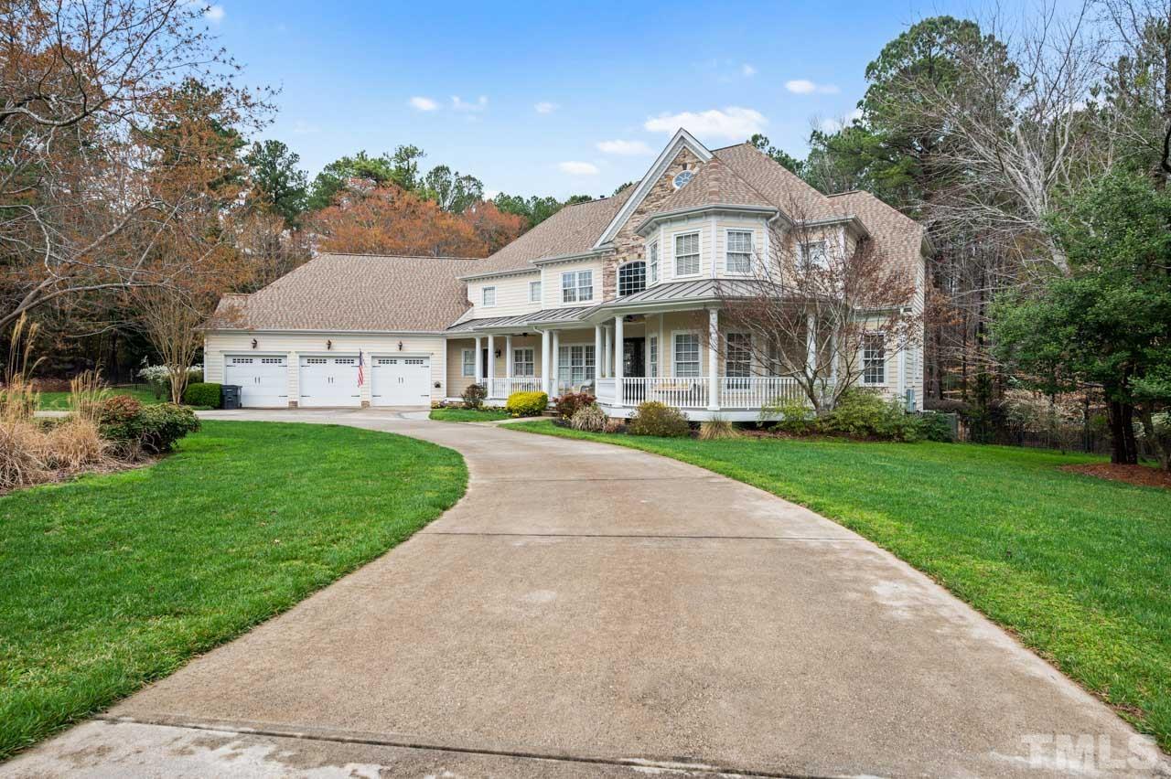 1605 Sharnbrook Court Raleigh, NC 27614 - Photo 2 of 63 a front view of a building with a garden and plants