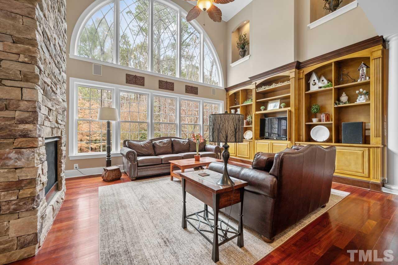 1605 Sharnbrook Court Raleigh, NC 27614 - Photo 21 of 63 a living room with furniture and a fireplace