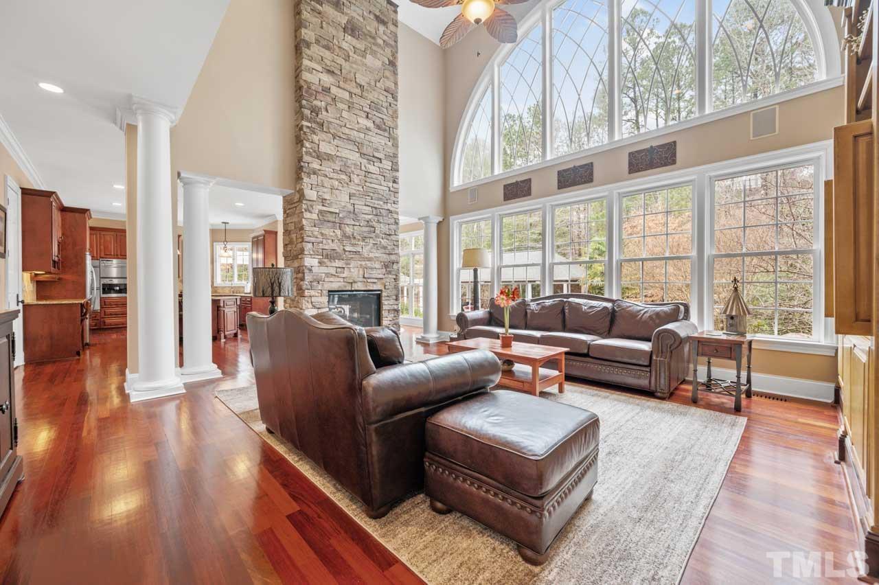 1605 Sharnbrook Court Raleigh, NC 27614 - Photo 22 of 63 a living room with furniture and a large window