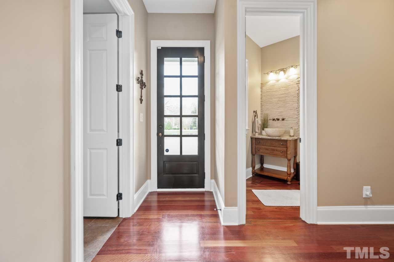 1605 Sharnbrook Court Raleigh, NC 27614 - Photo 30 of 63 a view of a hallway with a livingroom and a bathroom
