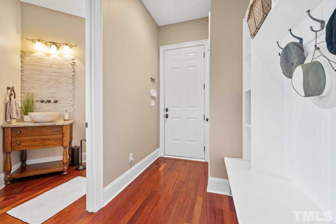 1605 Sharnbrook Court Raleigh, NC 27614 - Photo 31 of 63 a bathroom with a sink and a mirror