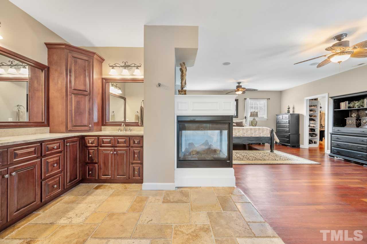 1605 Sharnbrook Court Raleigh, NC 27614 - Photo 48 of 63 a large spacious bathroom with a large tub and shower