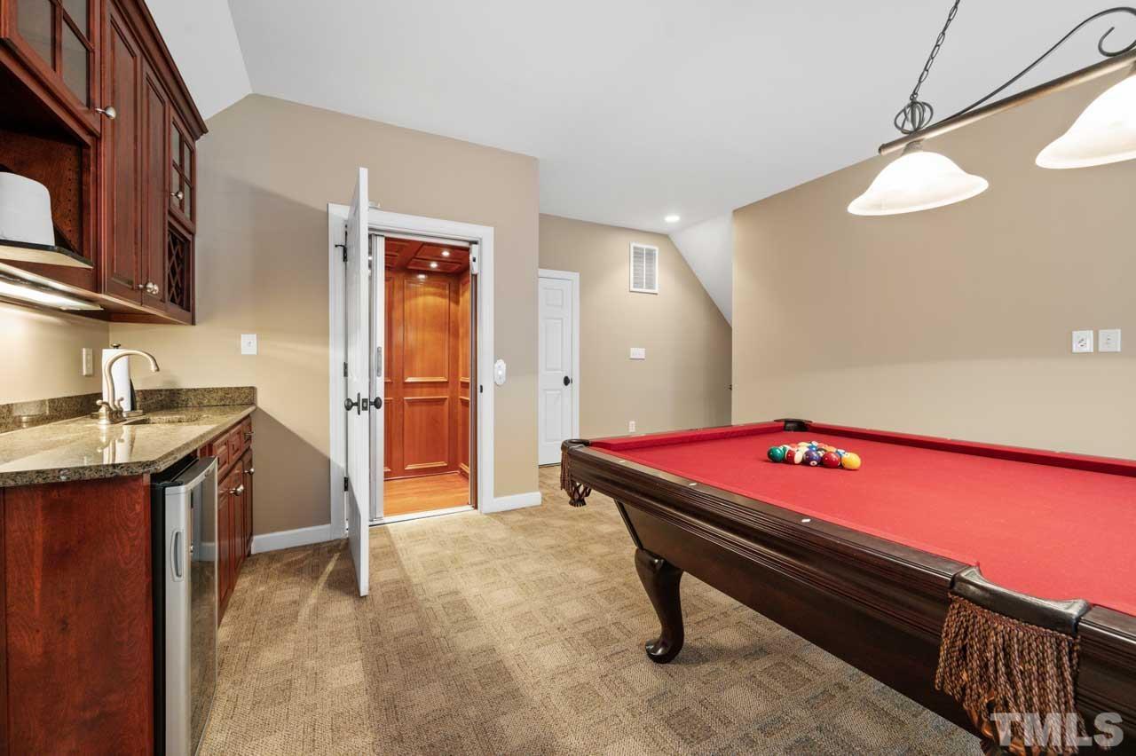 1605 Sharnbrook Court Raleigh, NC 27614 - Photo 60 of 63 a room with furniture and flat screen tv