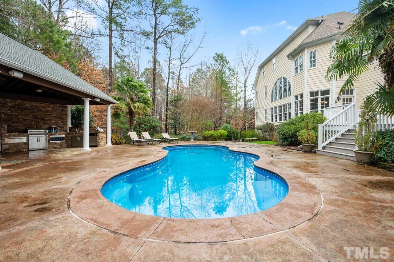 1605 Sharnbrook Court Raleigh, NC 27614 - Photo 6 of 63 a view of a swimming pool with a patio