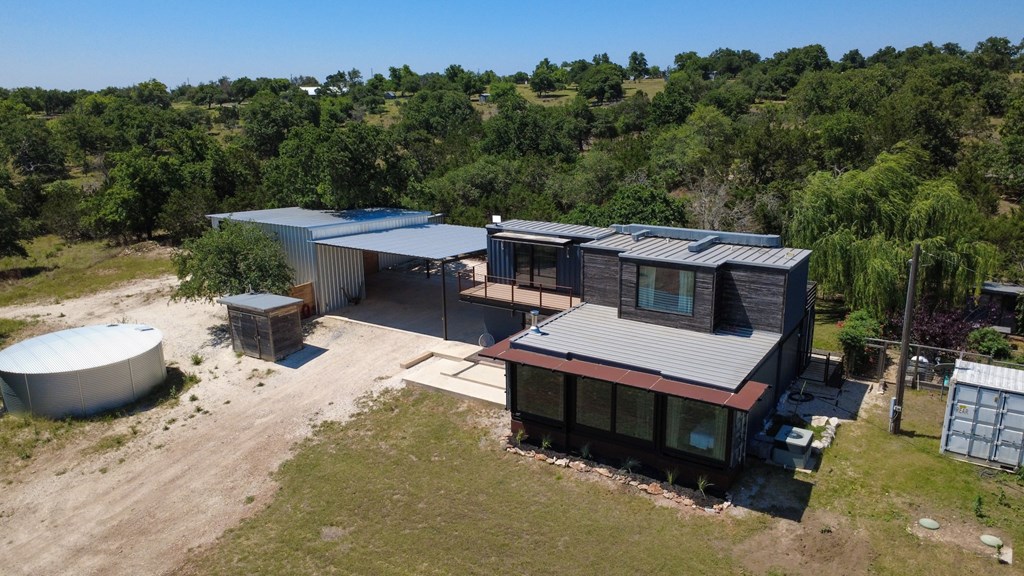 228-232 Spring Road Fredericksburg, TX 78624 - Photo 4 of 57 an aerial view of a house with swimming pool and garden
