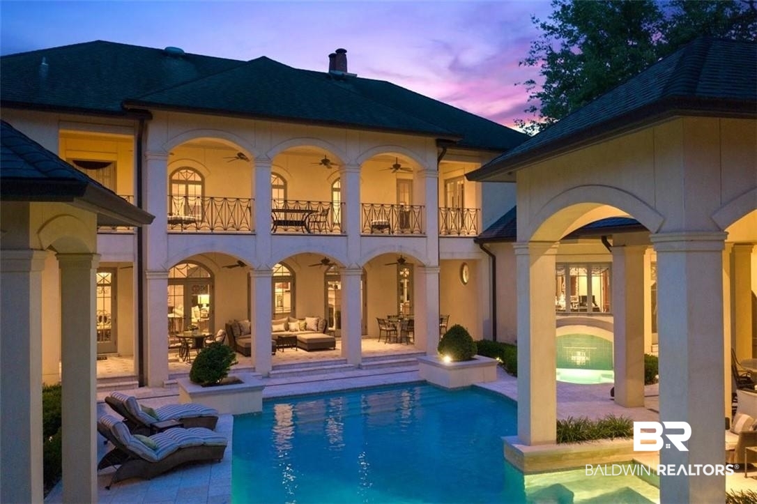 4 Chancery Court Mobile, AL 36608 - Photo 50 of 54 Back house at dusk featuring a balcony and a patio area