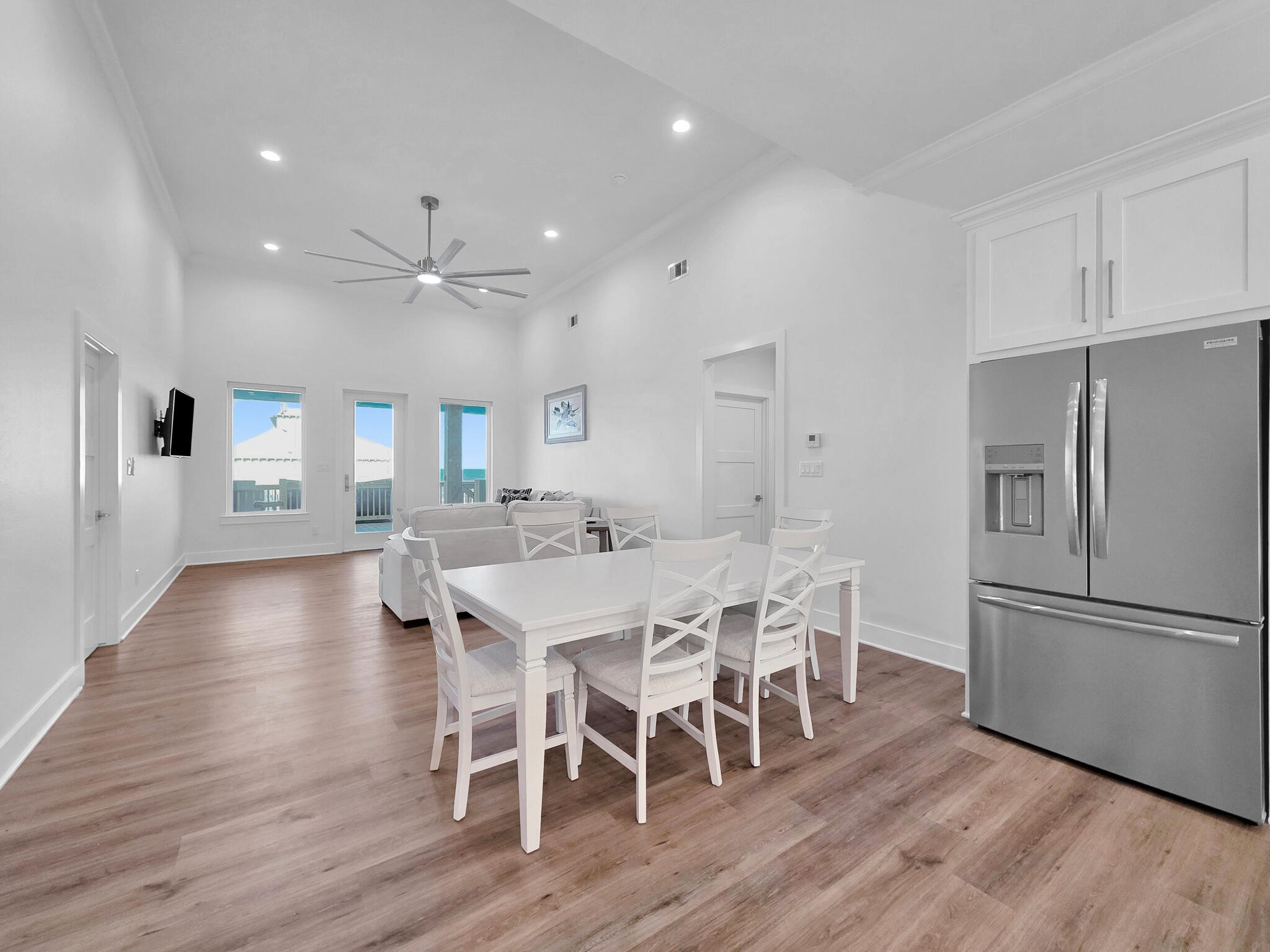 1221 Gulf Road Crystal Beach, TX 77650 - Photo 11 of 48 a view of a dining room with furniture a rug and wooden floor