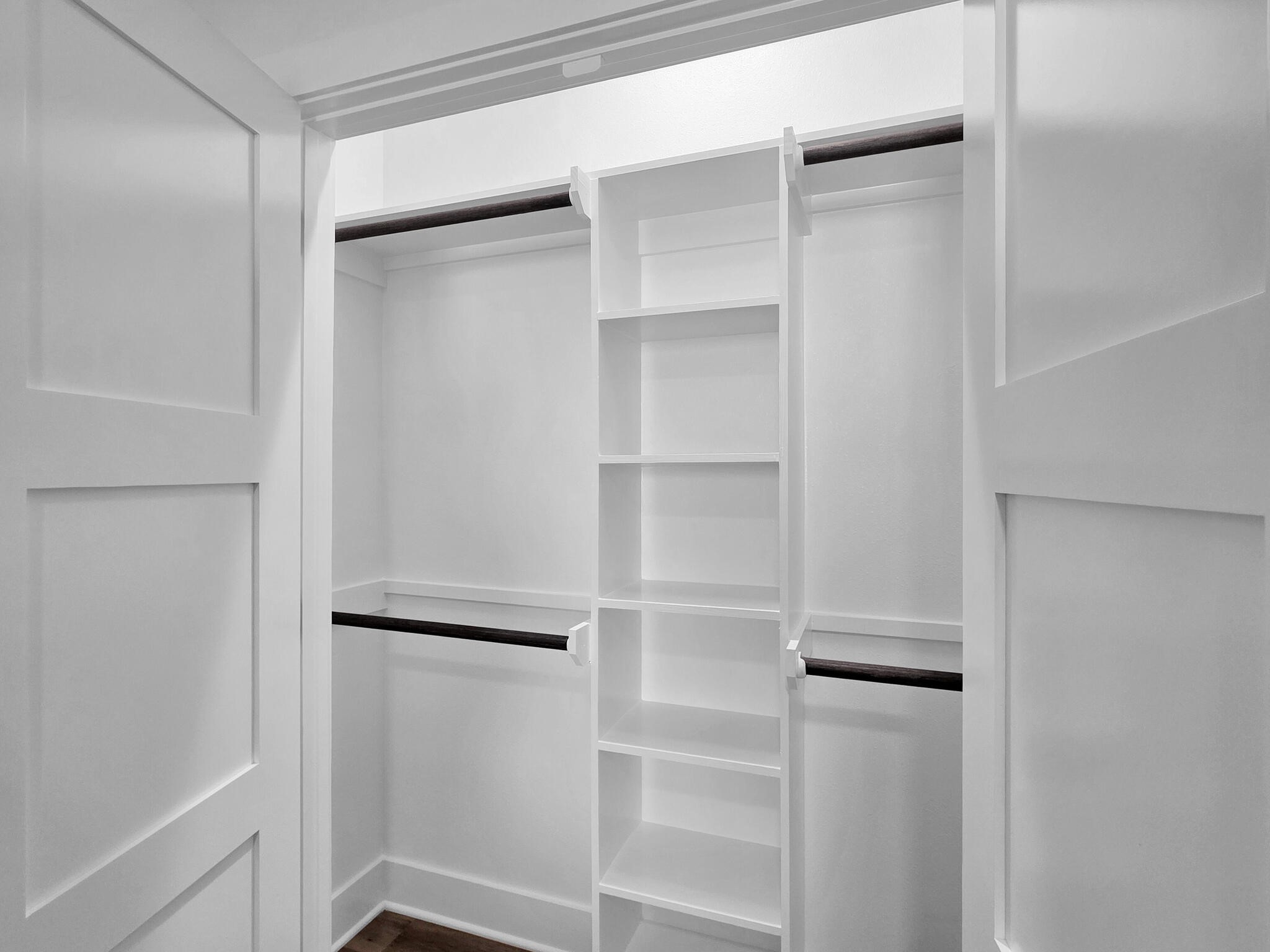 1221 Gulf Road Crystal Beach, TX 77650 - Photo 19 of 48 a view of walk in closet with empty racks