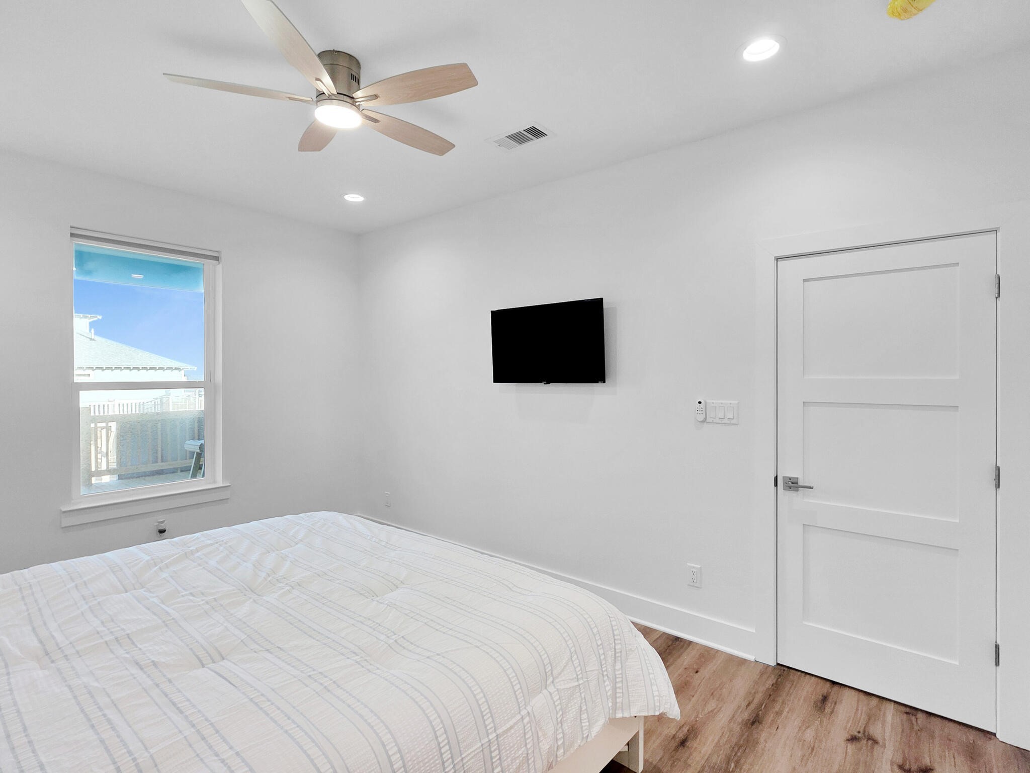 1221 Gulf Road Crystal Beach, TX 77650 - Photo 21 of 48 a bedroom with a bed and a flat screen tv