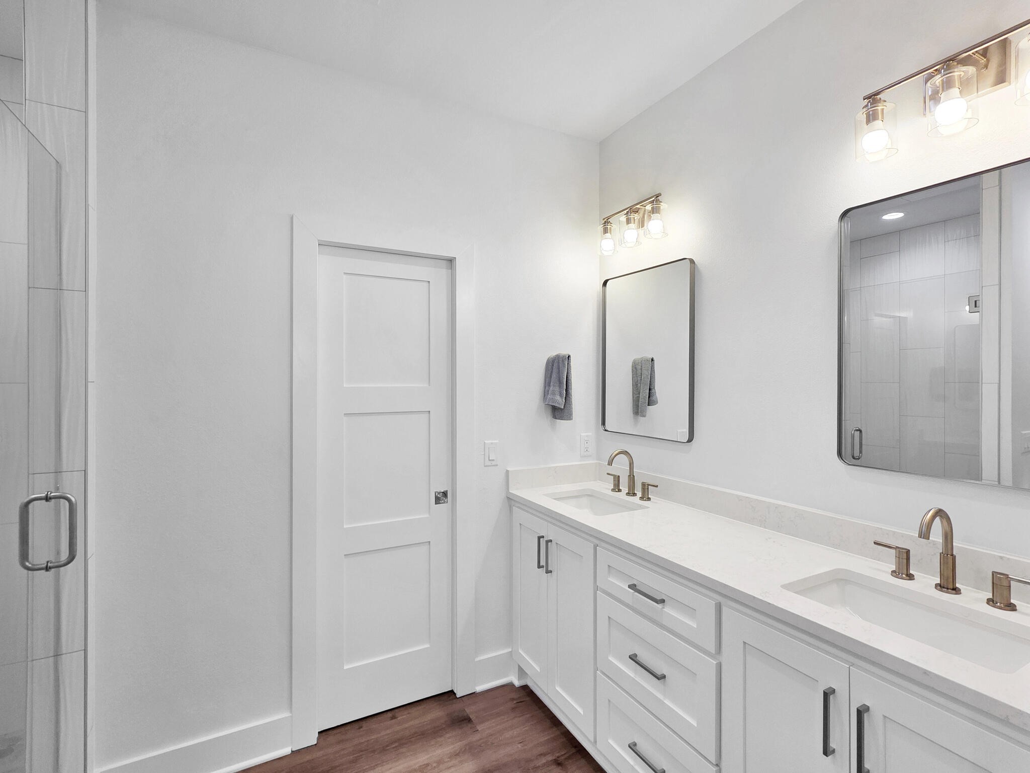 1221 Gulf Road Crystal Beach, TX 77650 - Photo 25 of 48 a bathroom with a double vanity sink and mirror