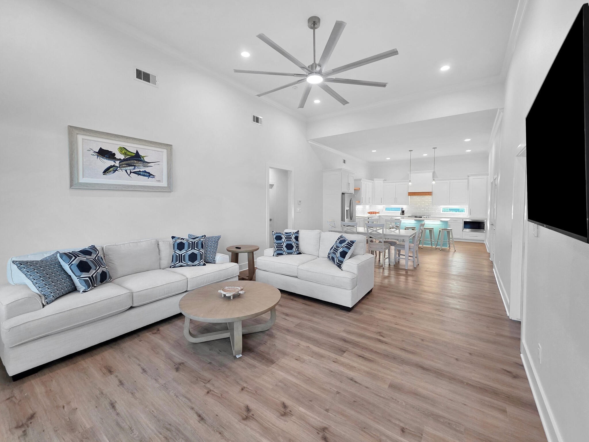 1221 Gulf Road Crystal Beach, TX 77650 - Photo 3 of 48 a living room with furniture and a flat screen tv