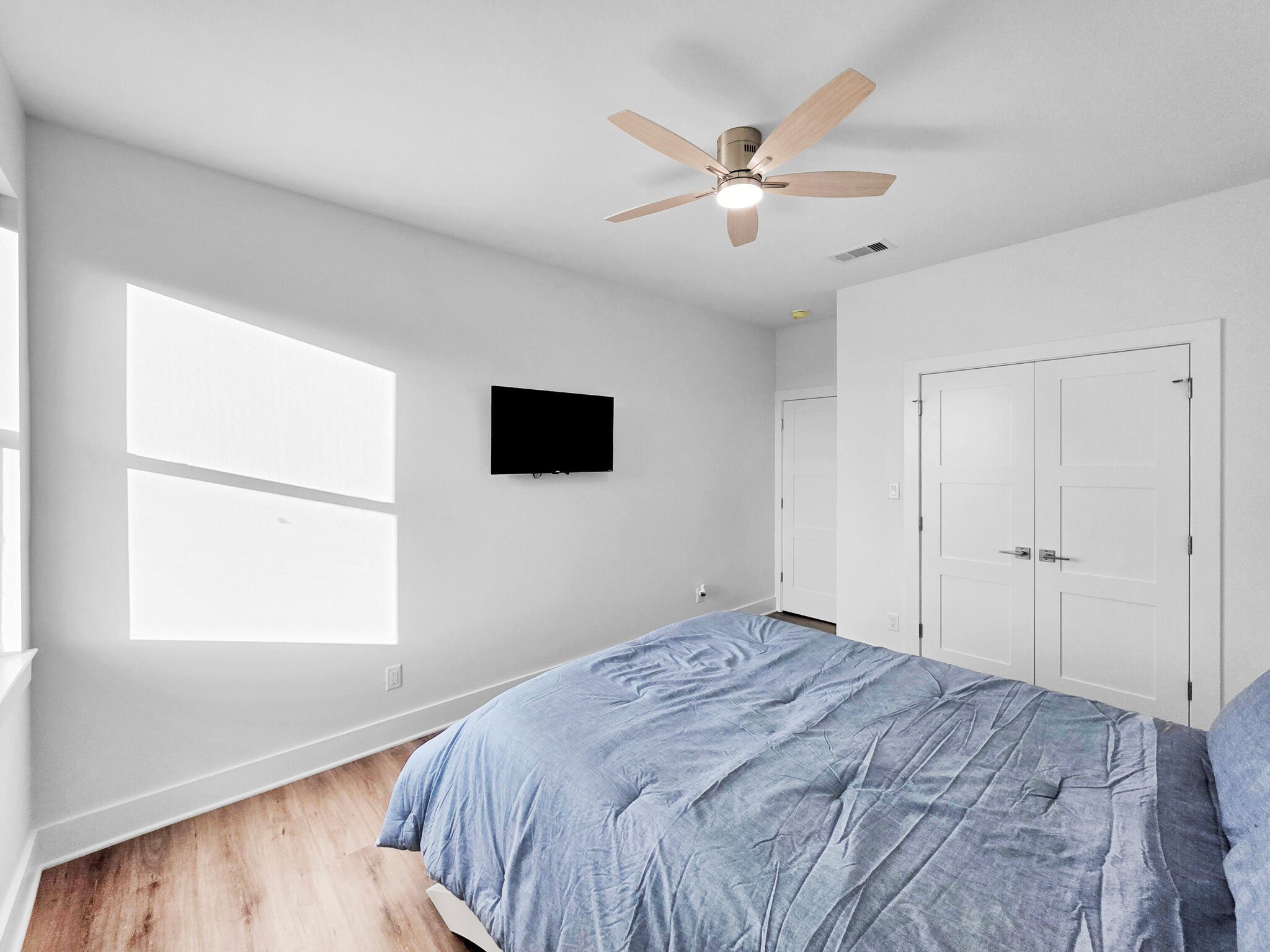 1221 Gulf Road Crystal Beach, TX 77650 - Photo 32 of 48 a bedroom with a large bed and a window