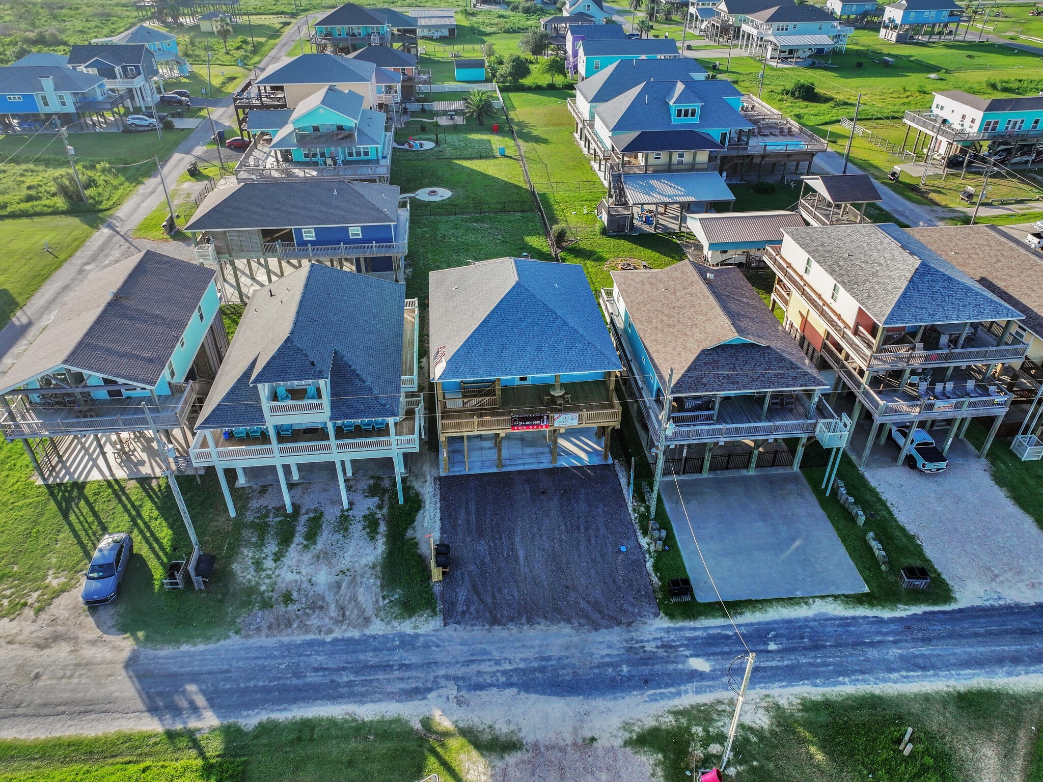 1221 Gulf Road Crystal Beach, TX 77650 - Photo 42 of 48 an aerial view of a house with swimming pool outdoor seating and yard